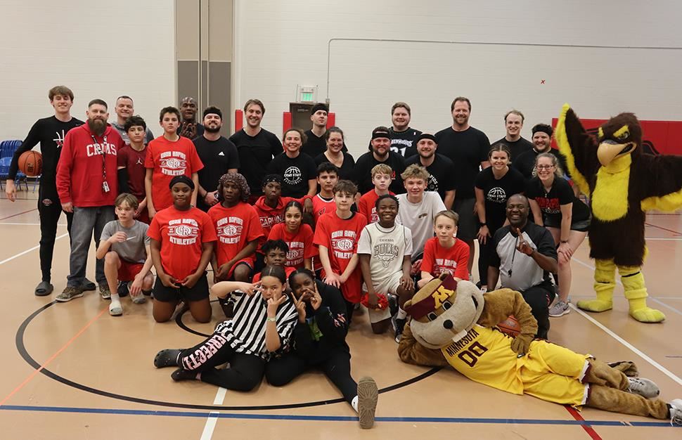 Coon Rapids Middle School students and staff basketball teams